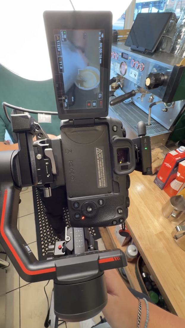 Camera monitor framing a product shot during a venue production